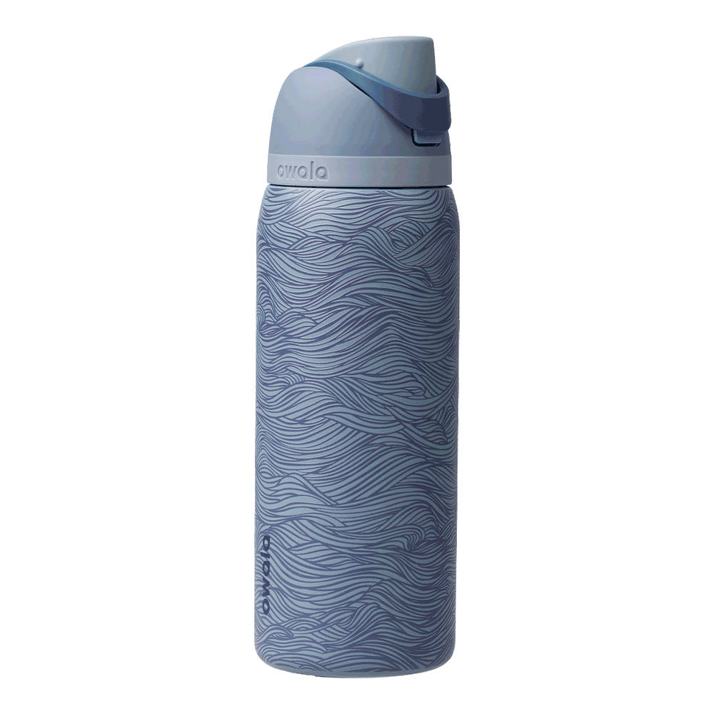 FreeSip 24oz Feeling Swell; rotating view of slate blue body with flowing wave line pattern in lighter blue tones, light blue flip cap, slate blue carry loop, and light blue lid