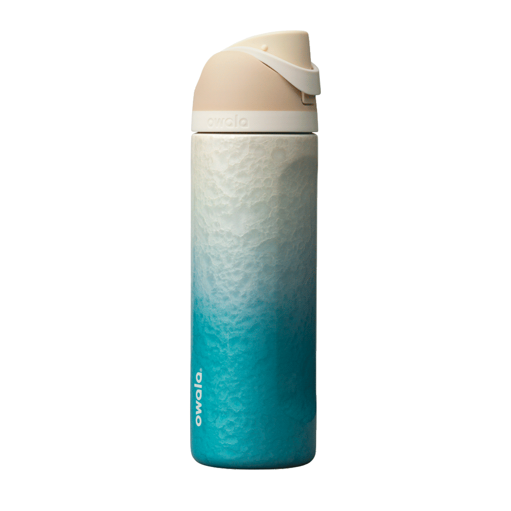 Owala Birthday Bash 24oz FreeSip Rolling In; gradient ombre from sandy cream at the top to vibrant teal blue at the base, with a cream-colored flip cap