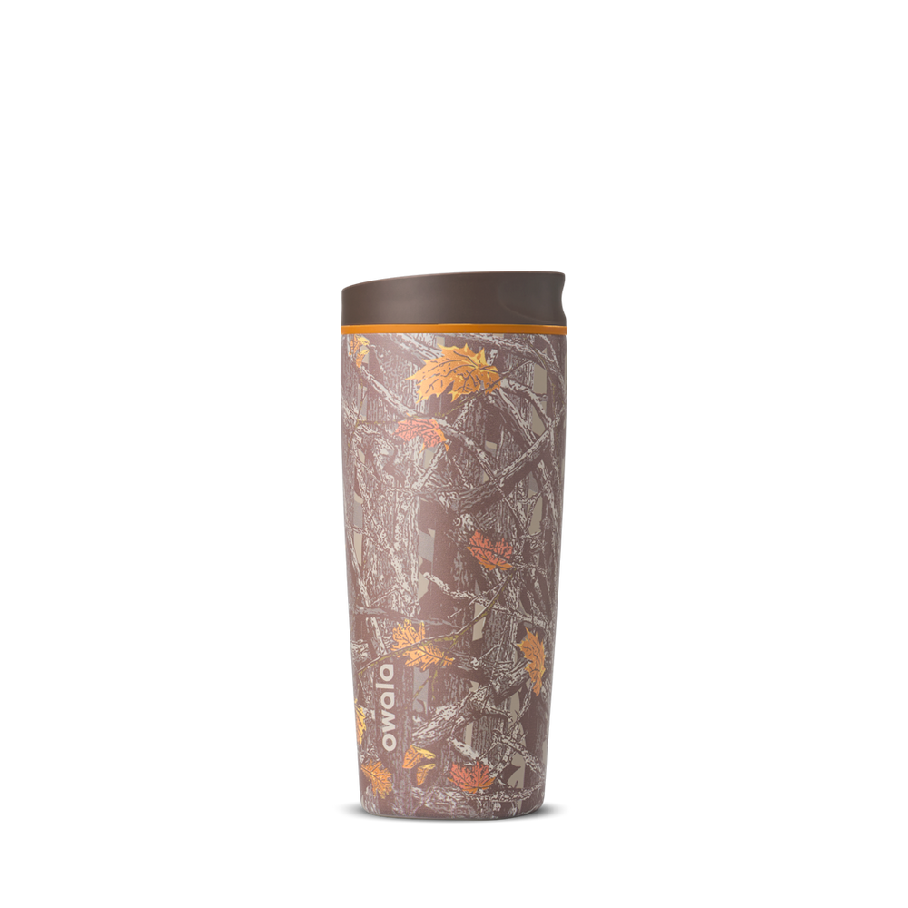 SmoothSip Slider 20oz in Out of Sight, brown forest Mossy Oak camouflage print with leaves and branches across the body, brown lid, and orange accent ring