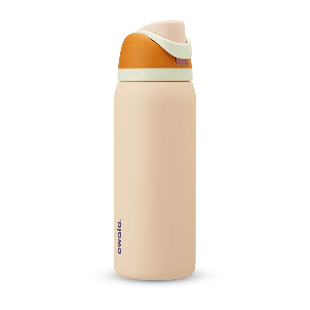 FreeSip 32oz in Water in the Desert, sand tan body with orange flip cap, mint green carry loop, and tan lid